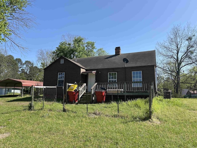 604 E Church St, Morrilton, AR 72110 - view of front of house featuring a front yard, a carport, a chimney, central air condition unit, and a wooden deck