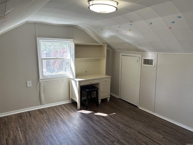 604 E Church St, Morrilton, AR 72110 - bonus room featuring visible vents, baseboards, vaulted ceiling, and dark wood-style floors