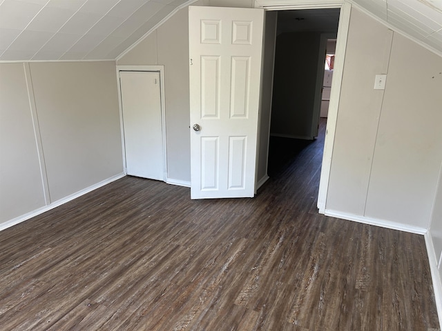 604 E Church St, Morrilton, AR 72110 - additional living space featuring baseboards, dark wood-style floors, and lofted ceiling