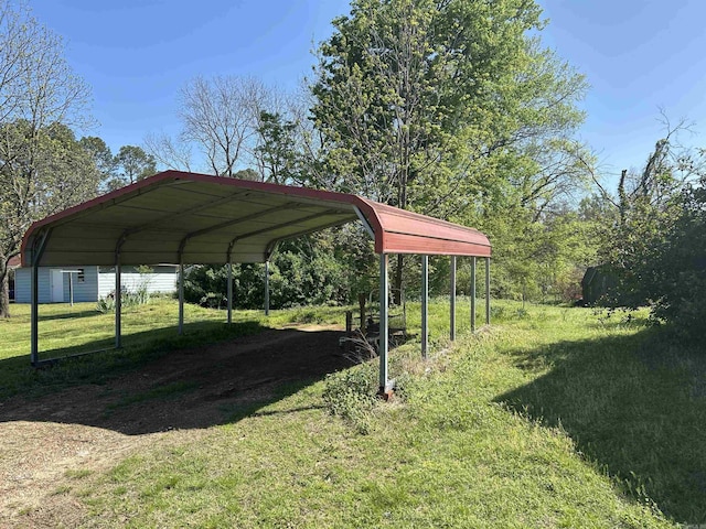 604 E Church St, Morrilton, AR 72110 - view of parking with a detached carport