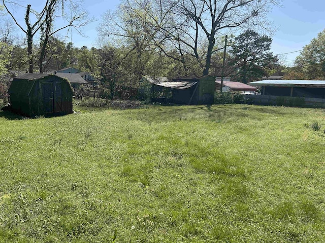 604 E Church St, Morrilton, AR 72110 - view of yard featuring an outbuilding and a shed