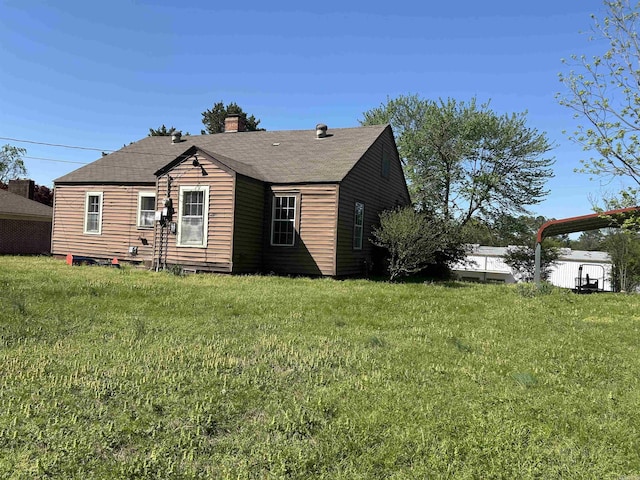 604 E Church St, Morrilton, AR 72110 - view of front of house featuring a front yard and a chimney