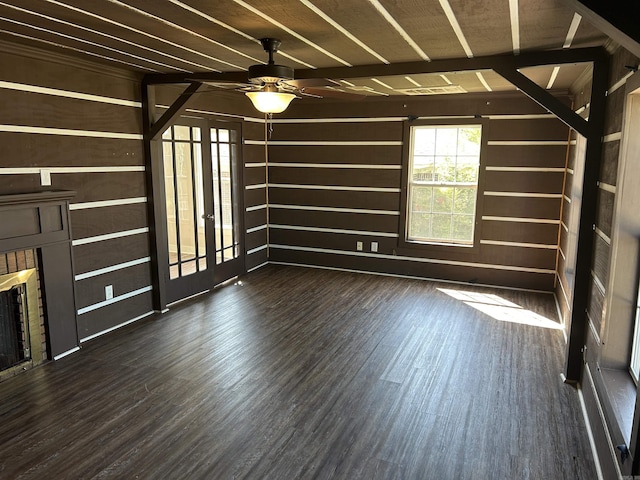 604 E Church St, Morrilton, AR 72110 - interior space with a ceiling fan, a fireplace, wooden walls, wood finished floors, and french doors