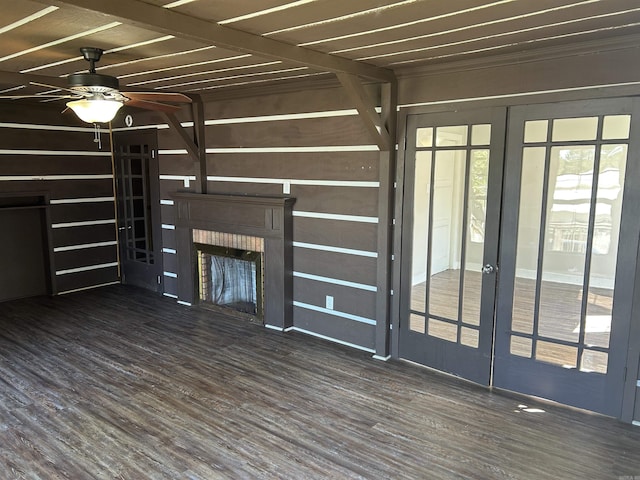 604 E Church St, Morrilton, AR 72110 - unfurnished living room featuring french doors, wood finished floors, a fireplace, and a ceiling fan