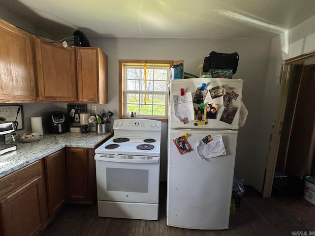 95 Terrafirma Ln, Ash Flat, AR 72513 - kitchen featuring brown cabinetry, dark wood-style floors, and white appliances