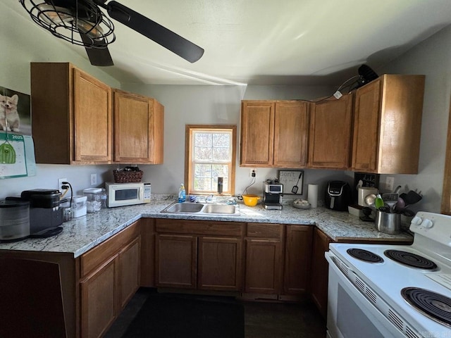 95 Terrafirma Ln, Ash Flat, AR 72513 - kitchen with a sink, white appliances, and brown cabinets