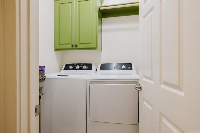 3015 Woodsgate, Little Rock, AR 72211 - laundry room featuring washing machine and clothes dryer and cabinet space