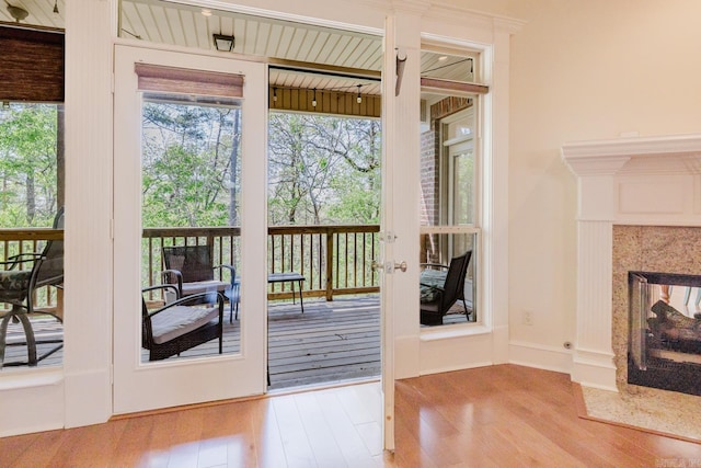 3015 Woodsgate, Little Rock, AR 72211 - doorway to outside with french doors, wood finished floors, and a multi sided fireplace