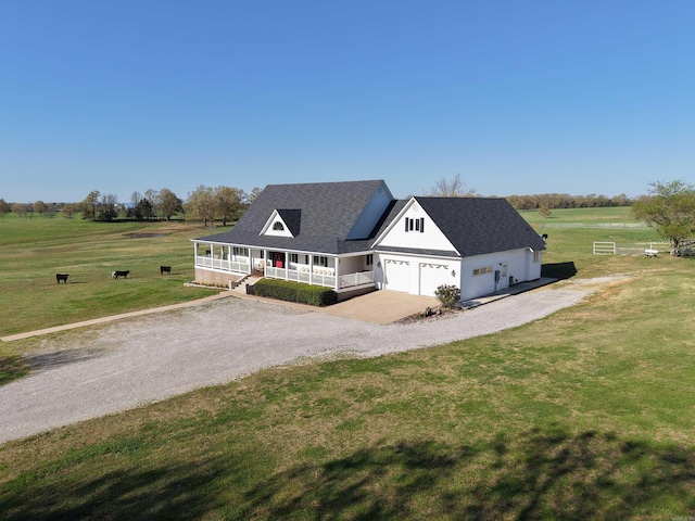 2832 Lacrosse Rd, Melbourne, AR 72556 - view of front of property with covered porch, roof with shingles, a front lawn, a garage, and driveway