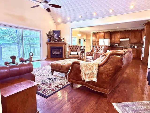 2832 Lacrosse Rd, Melbourne, AR 72556 - living area with high vaulted ceiling, a fireplace, dark wood finished floors, a ceiling fan, and wood ceiling