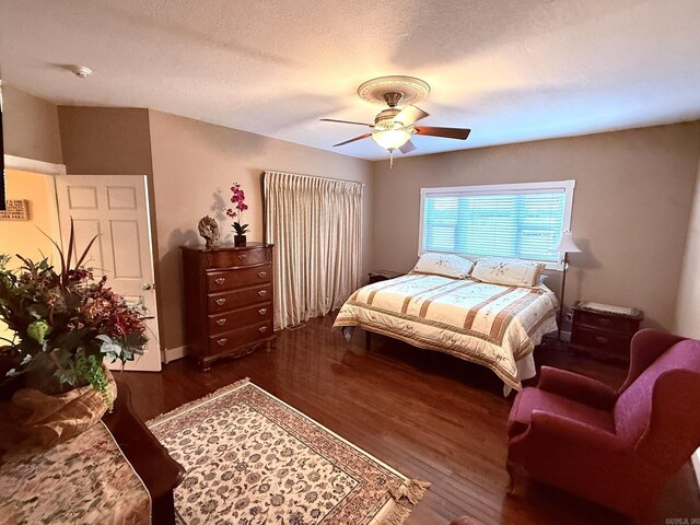 2832 Lacrosse Rd, Melbourne, AR 72556 - bedroom with ceiling fan, a textured ceiling, and wood finished floors
