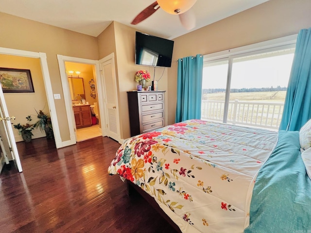2832 Lacrosse Rd, Melbourne, AR 72556 - bedroom featuring dark wood-style flooring, baseboards, ensuite bath, a ceiling fan, and access to exterior