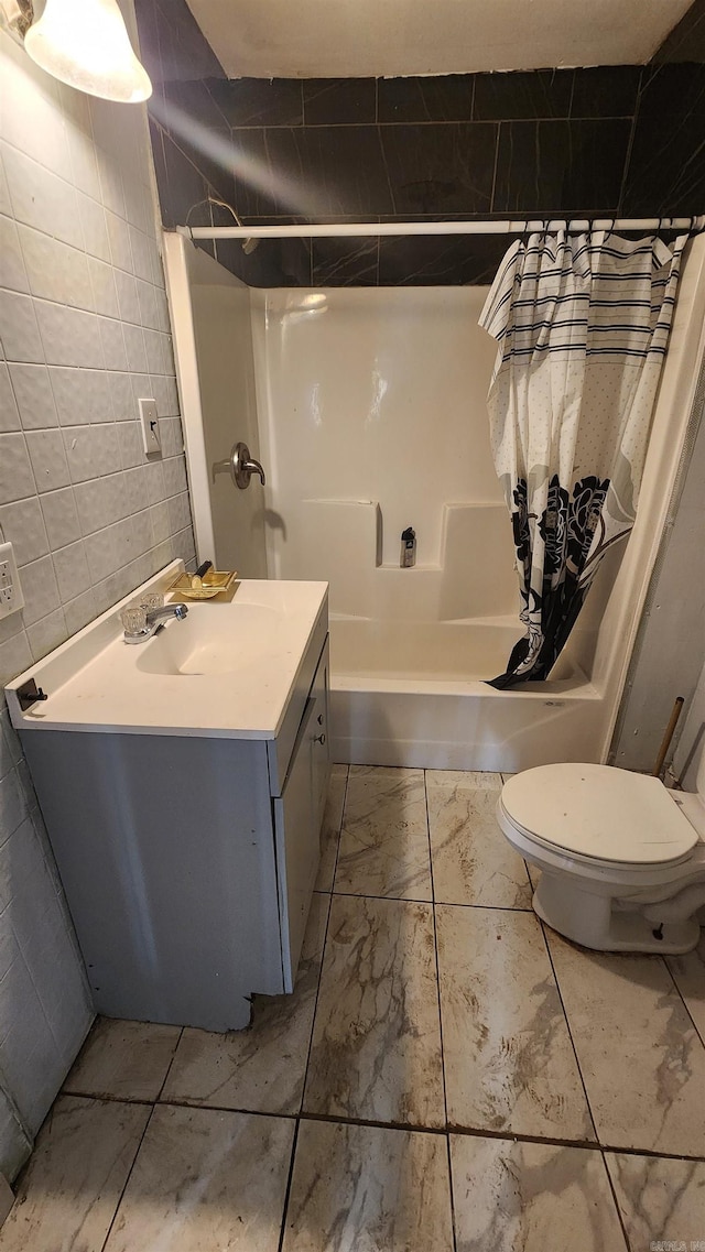 417B Mississippi St, Hot Springs, AR 71901 - bathroom featuring tile walls, shower / bath combo with shower curtain, marble look tile flooring, toilet, and vanity