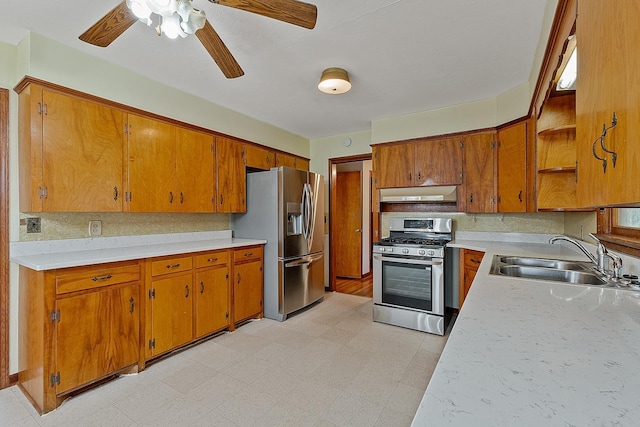 2812 N Church, Jonesboro, AR 72401 - kitchen featuring under cabinet range hood, a sink, light floors, and appliances with stainless steel finishes