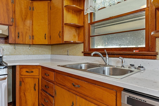 2812 N Church, Jonesboro, AR 72401 - kitchen featuring light countertops, brown cabinets, dishwasher, a sink, and electric range oven