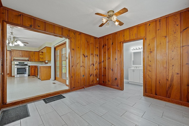 2812 N Church, Jonesboro, AR 72401 - interior space featuring ceiling fan, visible vents, appliances with stainless steel finishes, under cabinet range hood, and brown cabinets