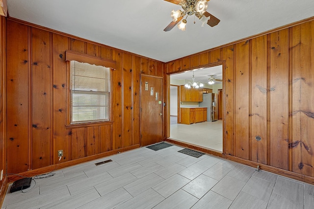 2812 N Church, Jonesboro, AR 72401 - foyer entrance featuring wood walls, ceiling fan, baseboards, and visible vents