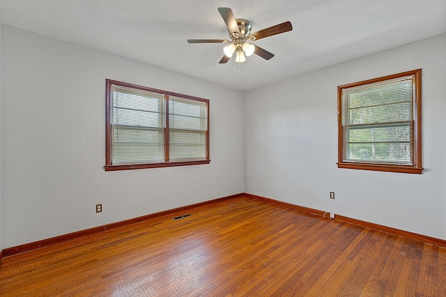 2812 N Church, Jonesboro, AR 72401 - unfurnished room with visible vents, baseboards, wood-type flooring, and ceiling fan