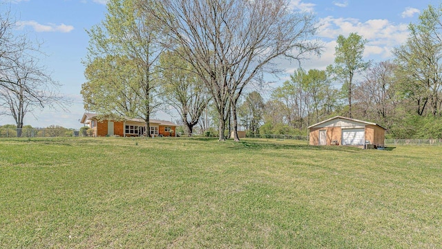 2812 N Church, Jonesboro, AR 72401 - view of yard with a rural view, a detached garage, fence, and an outdoor structure