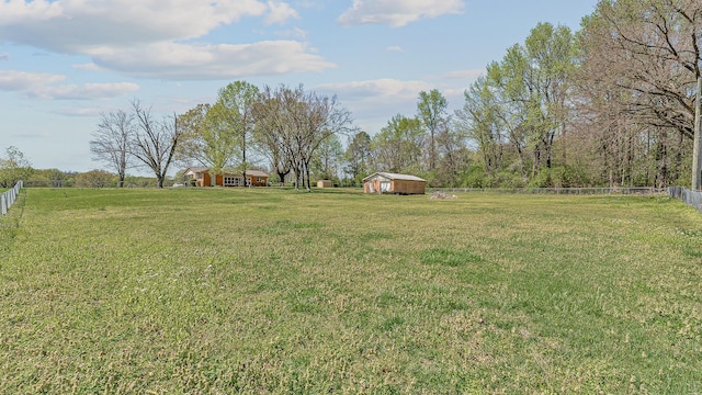 2812 N Church, Jonesboro, AR 72401 - view of yard with a rural view, a storage unit, fence, and an outdoor structure