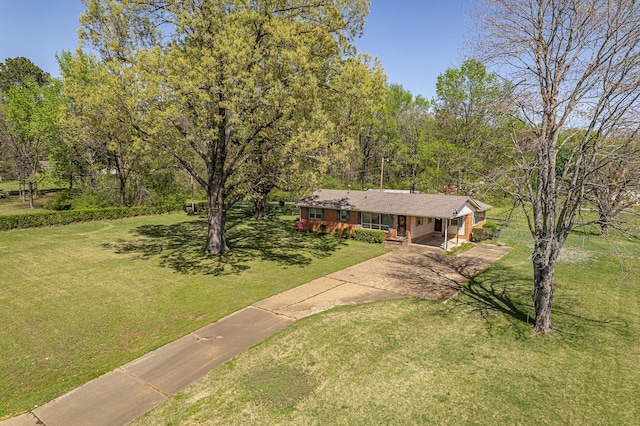 2812 N Church, Jonesboro, AR 72401 - view of front of house featuring a front yard, a carport, covered porch, and driveway