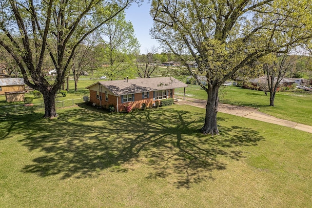 2812 N Church, Jonesboro, AR 72401 - exterior space with a carport, driveway, fence, and a front lawn