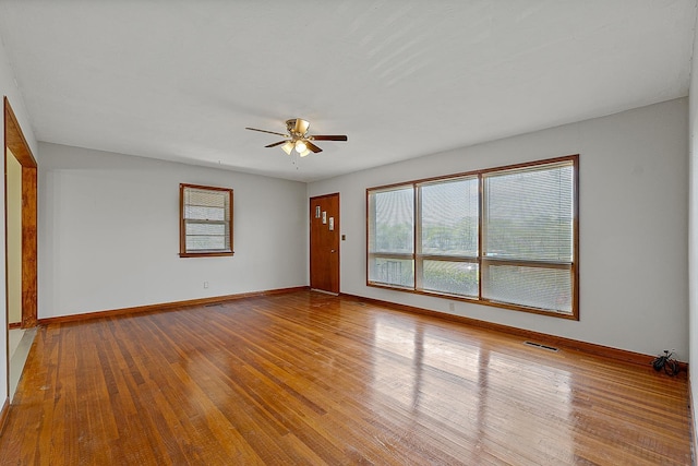 2812 N Church, Jonesboro, AR 72401 - unfurnished room featuring visible vents, ceiling fan, wood-type flooring, and baseboards
