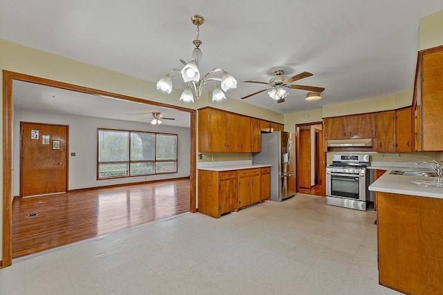 2812 N Church, Jonesboro, AR 72401 - kitchen featuring stainless steel appliances, brown cabinetry, a sink, and light floors