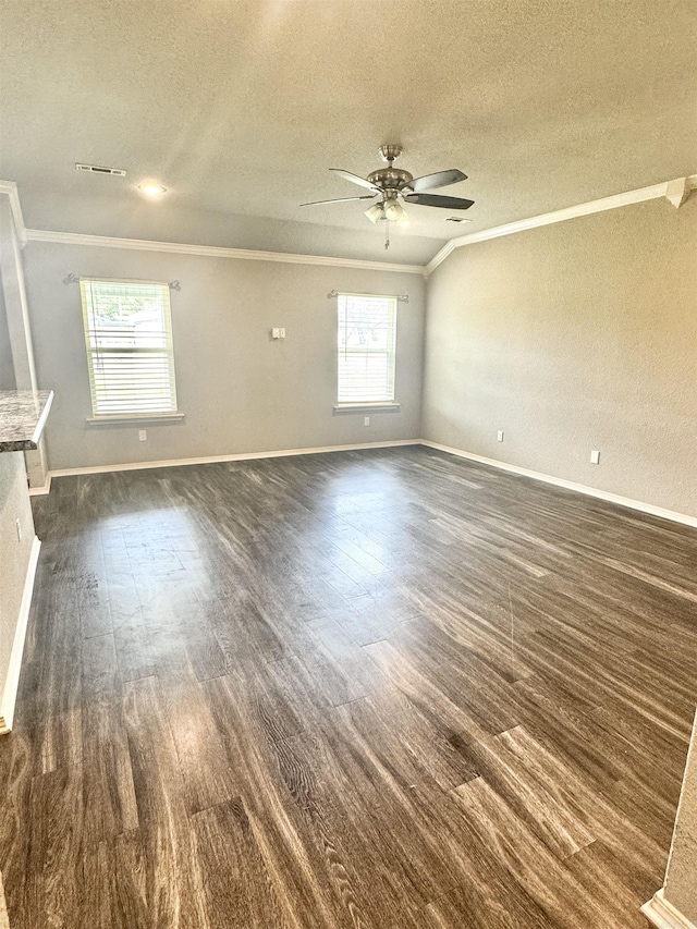 unfurnished living room with dark wood-style flooring, a textured ceiling, crown molding, visible vents, and ceiling fan
