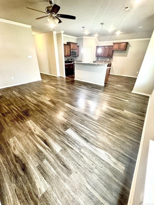 unfurnished living room featuring visible vents, a ceiling fan, dark wood finished floors, crown molding, and a textured ceiling