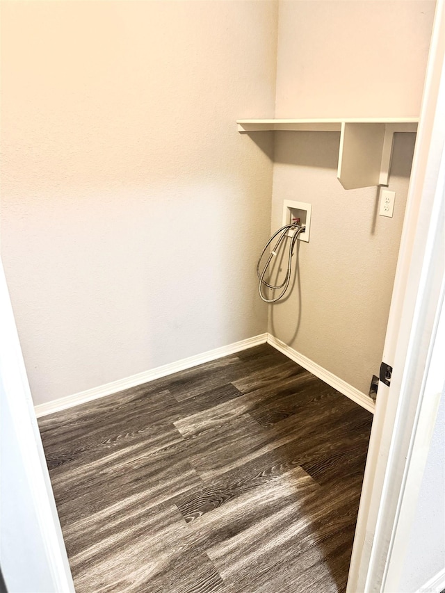 clothes washing area with laundry area, dark wood finished floors, baseboards, and hookup for a washing machine