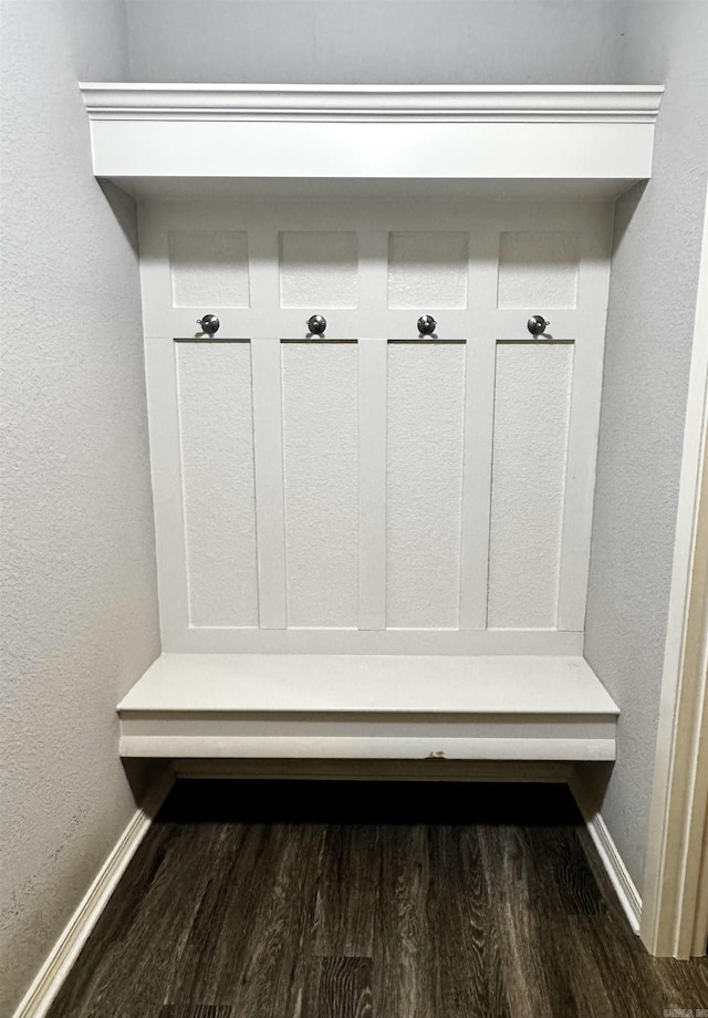 mudroom with baseboards and wood finished floors