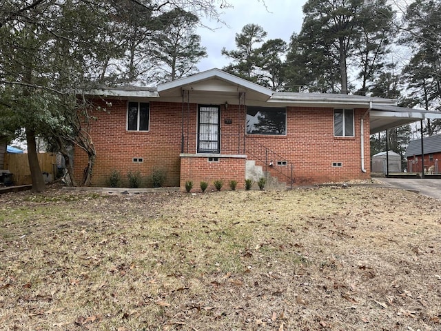 77 Broadmoor Dr, Little Rock, AR 72204 - view of front of property with a carport, fence, brick siding, and crawl space