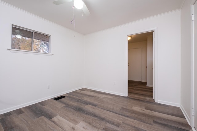 77 Broadmoor Dr, Little Rock, AR 72204 - unfurnished room featuring crown molding, visible vents, baseboards, and dark wood-style floors