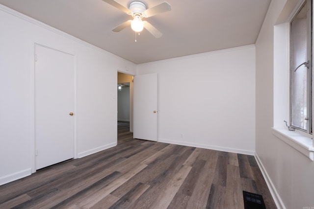77 Broadmoor Dr, Little Rock, AR 72204 - unfurnished bedroom featuring dark wood-style floors, baseboards, ornamental molding, and visible vents