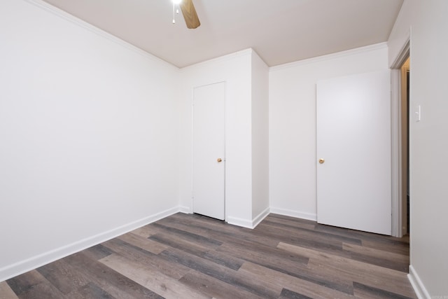 77 Broadmoor Dr, Little Rock, AR 72204 - unfurnished bedroom with dark wood-type flooring, baseboards, and crown molding