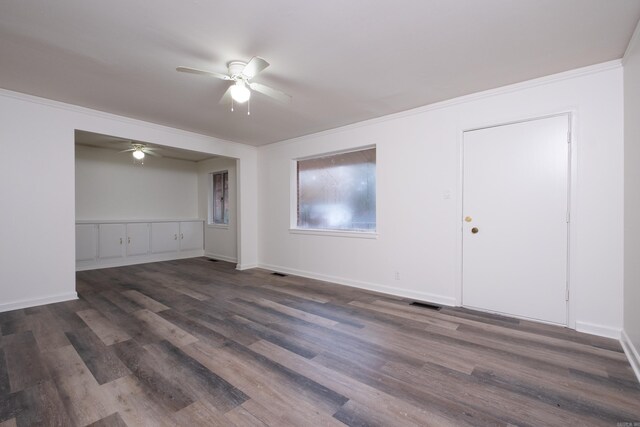 77 Broadmoor Dr, Little Rock, AR 72204 - spare room with ornamental molding, ceiling fan, dark wood finished floors, and visible vents