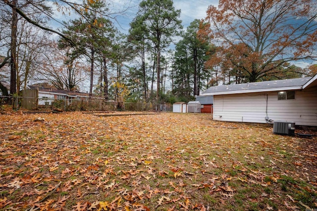 77 Broadmoor Dr, Little Rock, AR 72204 - view of yard with an outbuilding, fence, cooling unit, and a shed