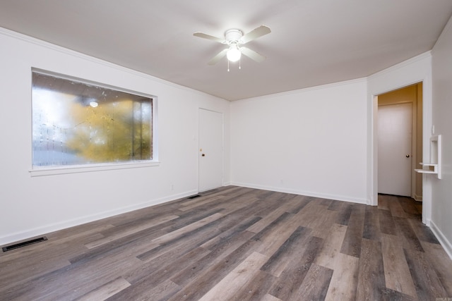 77 Broadmoor Dr, Little Rock, AR 72204 - unfurnished room with visible vents, baseboards, ornamental molding, a ceiling fan, and wood finished floors