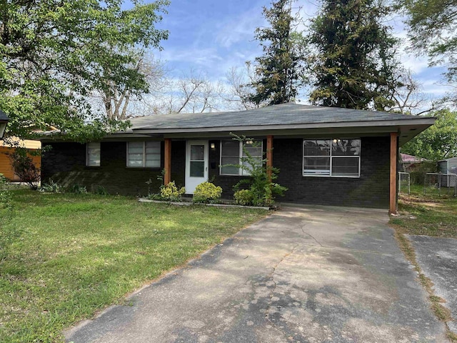 1607 Belmoor, Pine Bluff, AR 71601 - ranch-style home with driveway, a front lawn, and brick siding