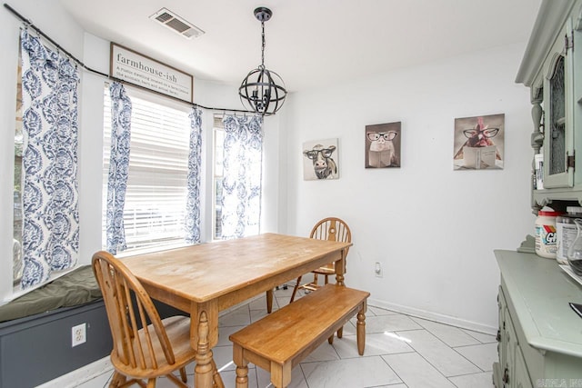 3712 Hazelwood Dr, Benton, AR 72015 - dining space with visible vents, baseboards, a notable chandelier, and light tile patterned floors