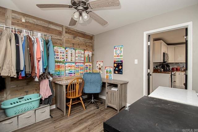 3712 Hazelwood Dr, Benton, AR 72015 - office area with wood walls, wood finished floors, ceiling fan, and baseboards