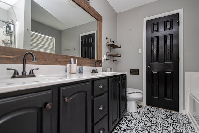 3712 Hazelwood Dr, Benton, AR 72015 - bathroom featuring double vanity, visible vents, a sink, and toilet