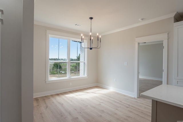 240 Michelle Dr, Beebe, AR 72012 - unfurnished dining area with ornamental molding, visible vents, light wood finished floors, and an inviting chandelier