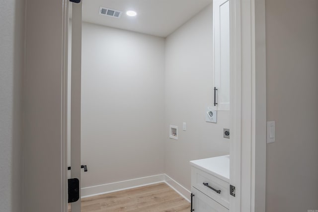 240 Michelle Dr, Beebe, AR 72012 - laundry area featuring electric dryer hookup, baseboards, light wood-style floors, visible vents, and hookup for a washing machine