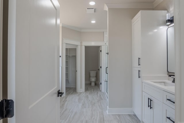 240 Michelle Dr, Beebe, AR 72012 - full bath with baseboards, ornamental molding, a spacious closet, toilet, and vanity