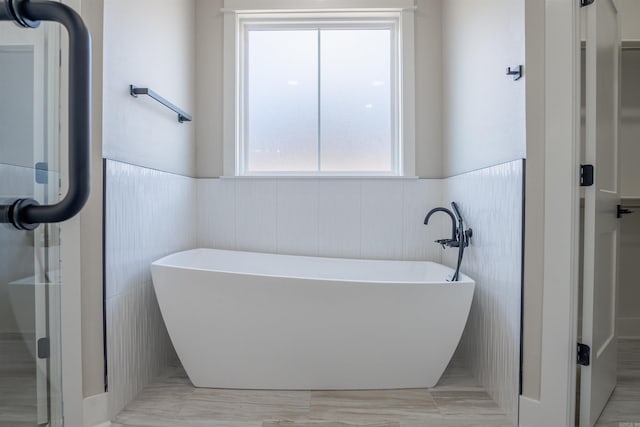 240 Michelle Dr, Beebe, AR 72012 - bathroom with a soaking tub and wainscoting
