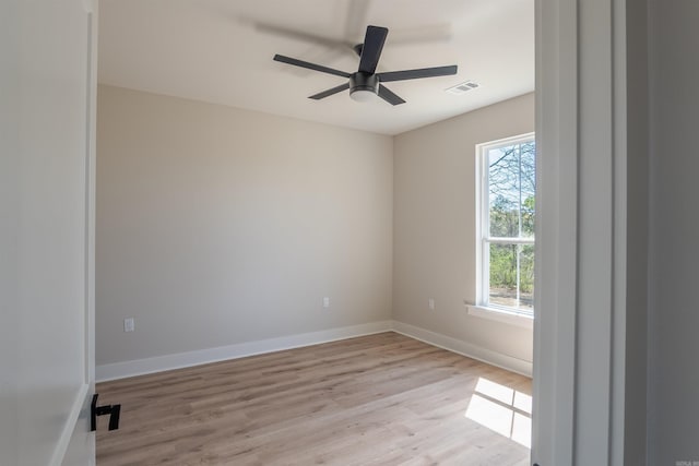 240 Michelle Dr, Beebe, AR 72012 - empty room featuring visible vents, baseboards, light wood-style flooring, and a healthy amount of sunlight