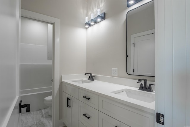 240 Michelle Dr, Beebe, AR 72012 - full bathroom with double vanity, marble finish floor, a sink, and toilet