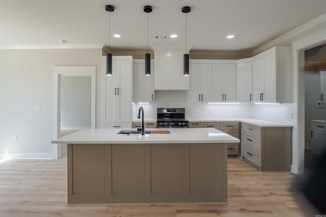 240 Michelle Dr, Beebe, AR 72012 - kitchen featuring tasteful backsplash, stainless steel stove, a sink, and visible vents